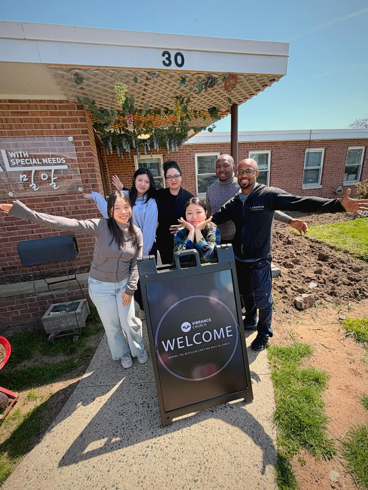 Welcoming visitors at the church entrance