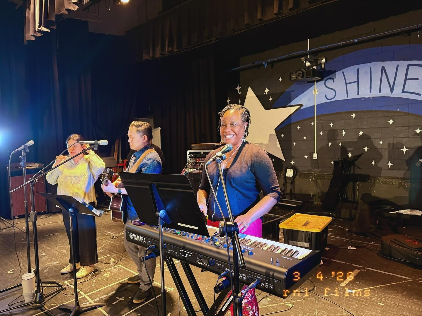 Worship team leading on stage